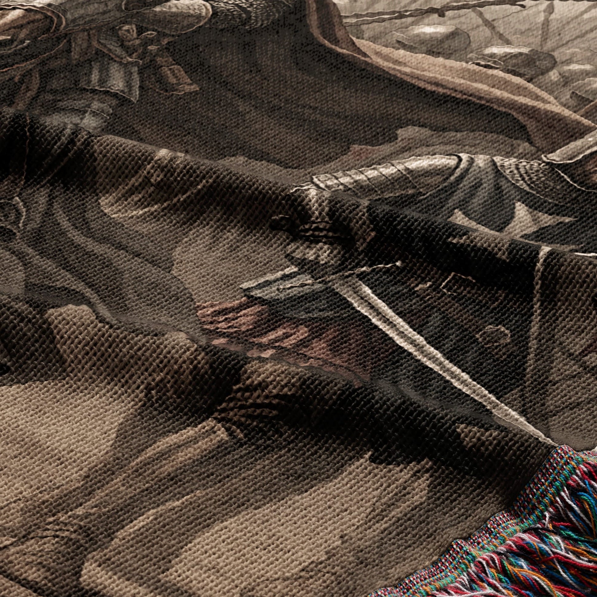 Tapestry detail showing knights in armor with swords and a fringed edge.