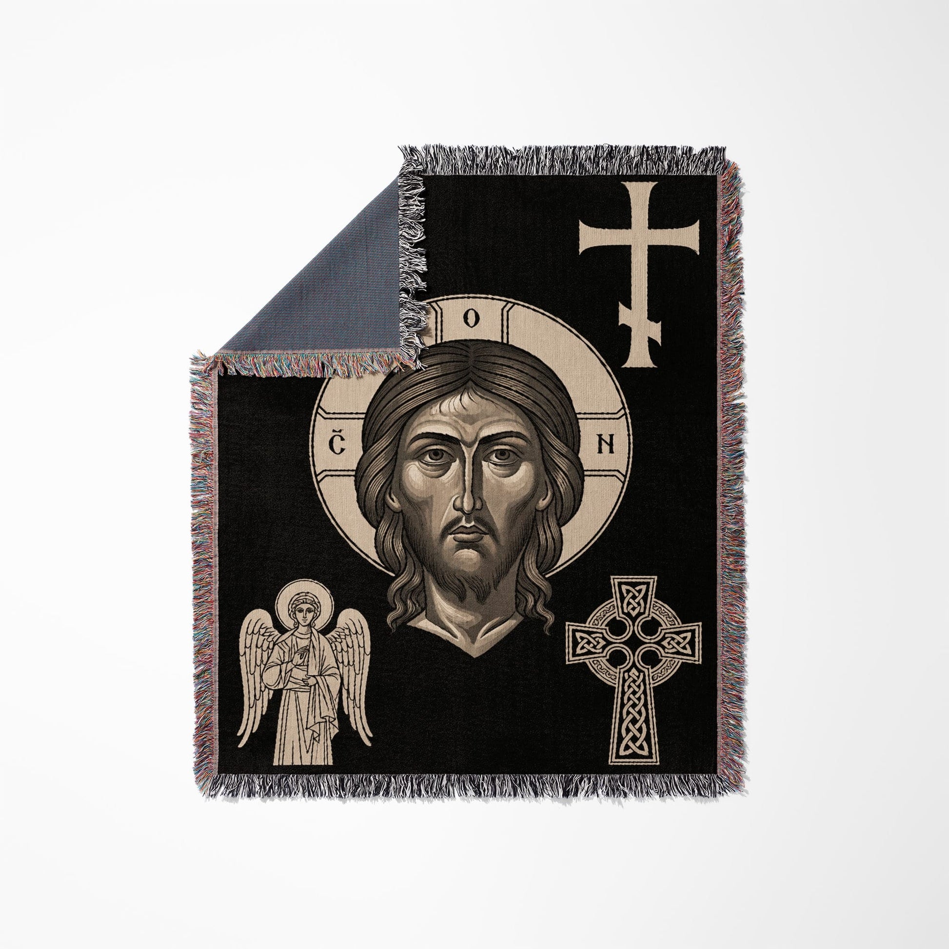 Black throw blanket with religious icons of Jesus, an angel, and crosses.