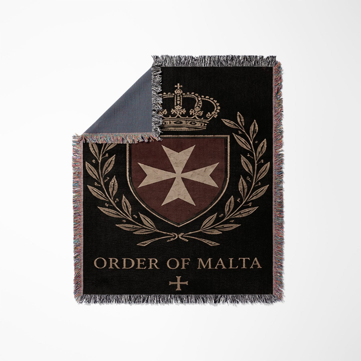 Order of Malta crest with crown and laurel branches on a dark blanket.