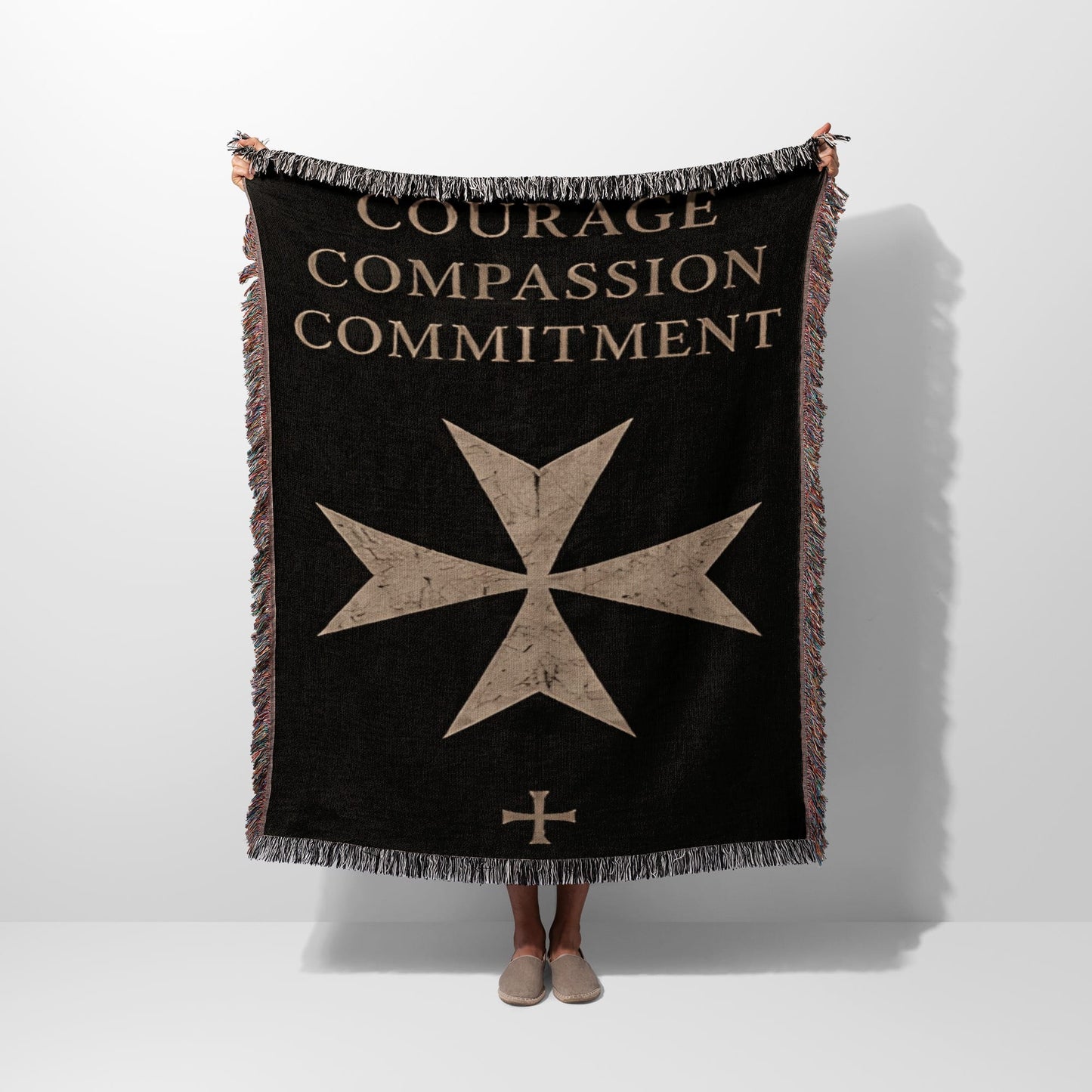 Black throw blanket with "COURAGE COMPASSION COMMITMENT" and Maltese cross.