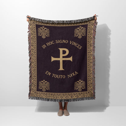 Dark tapestry blanket with Chi Rho symbol and Latin text "In Hoc Signo Vinces".