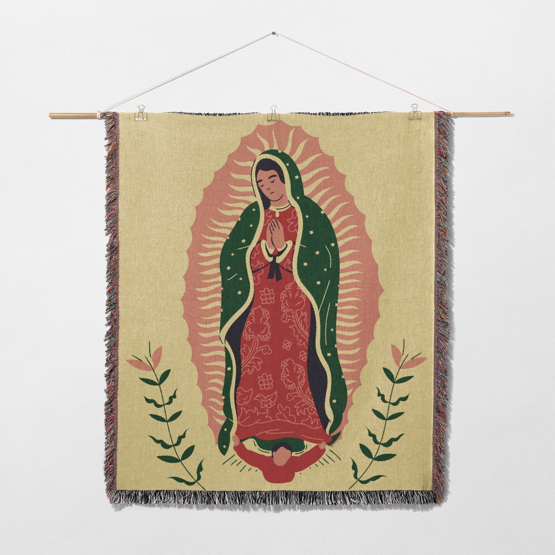 Woven tapestry featuring Our Lady of Guadalupe with floral accents.