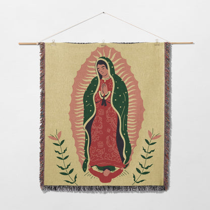 Woven tapestry featuring Our Lady of Guadalupe with floral accents.