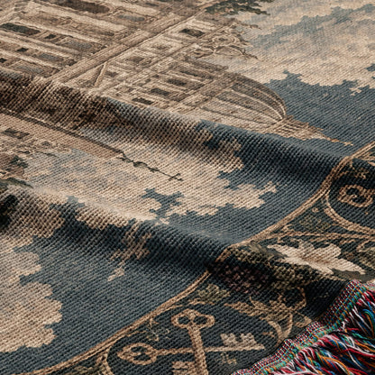 A woven throw blanket featuring a classic architectural tapestry design with multicolored fringed edges.