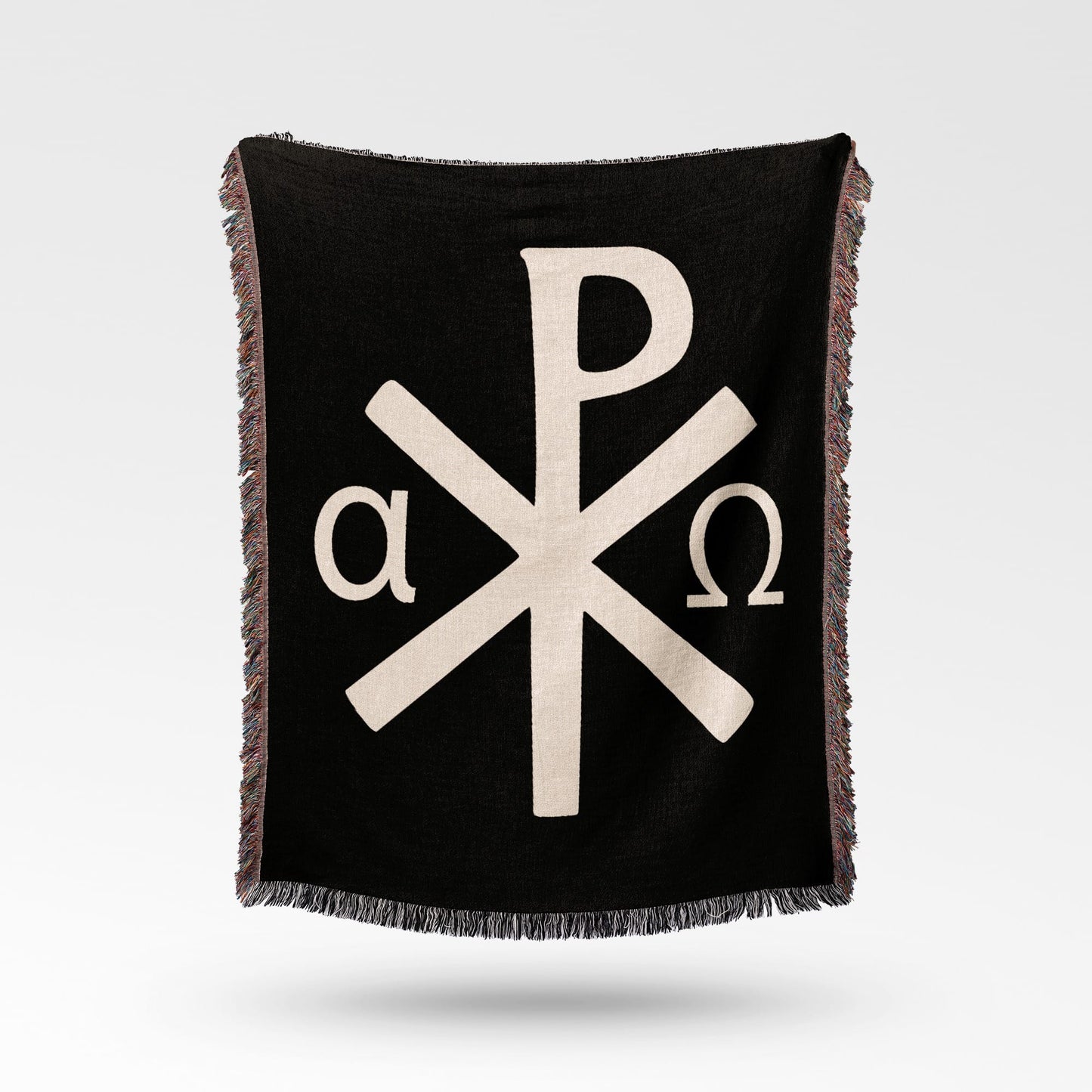 Black throw blanket with beige Chi Rho symbol and alpha omega letters.