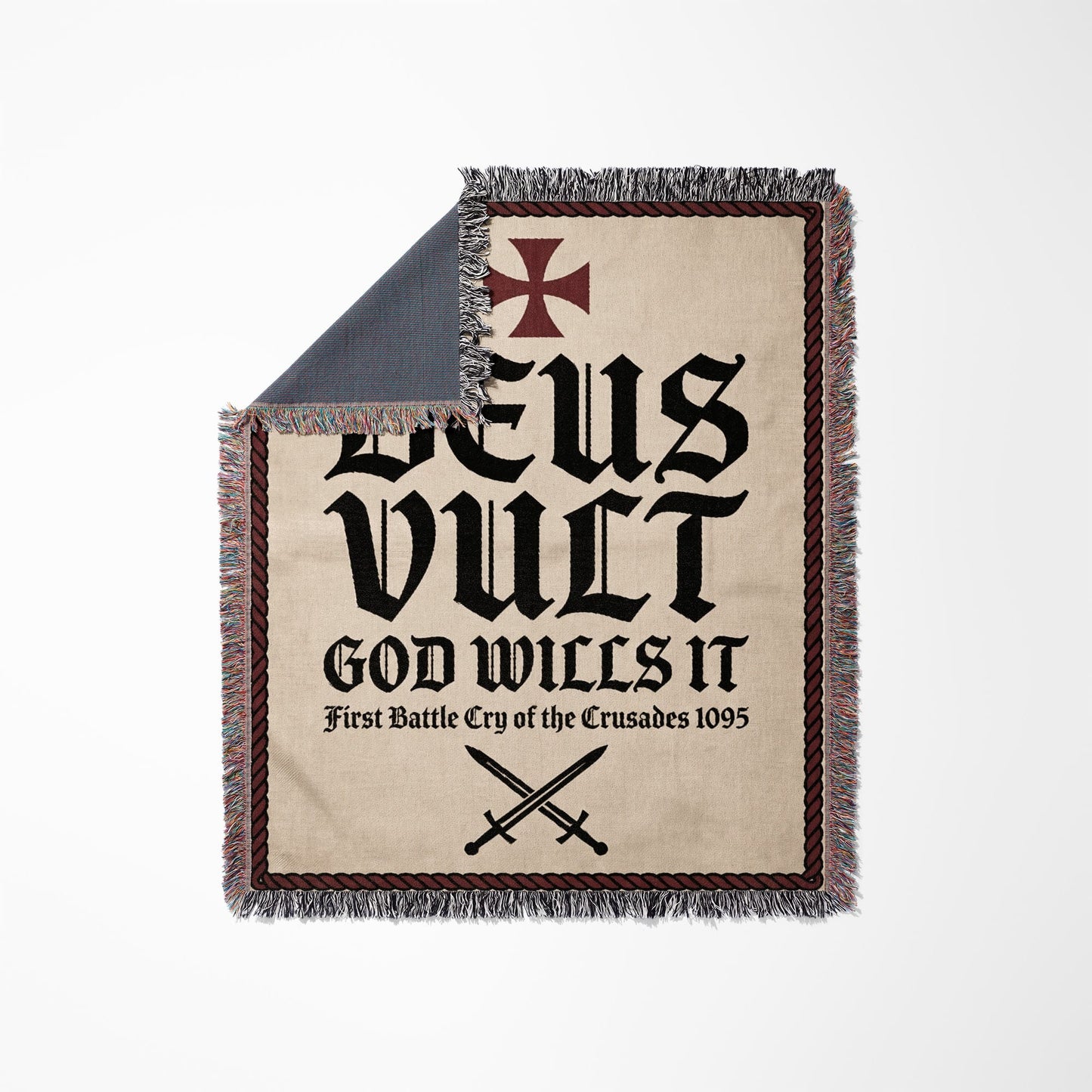 Woven blanket with "Deus Vult God Wills It First Battle Cry of the Crusades 1095" text.
