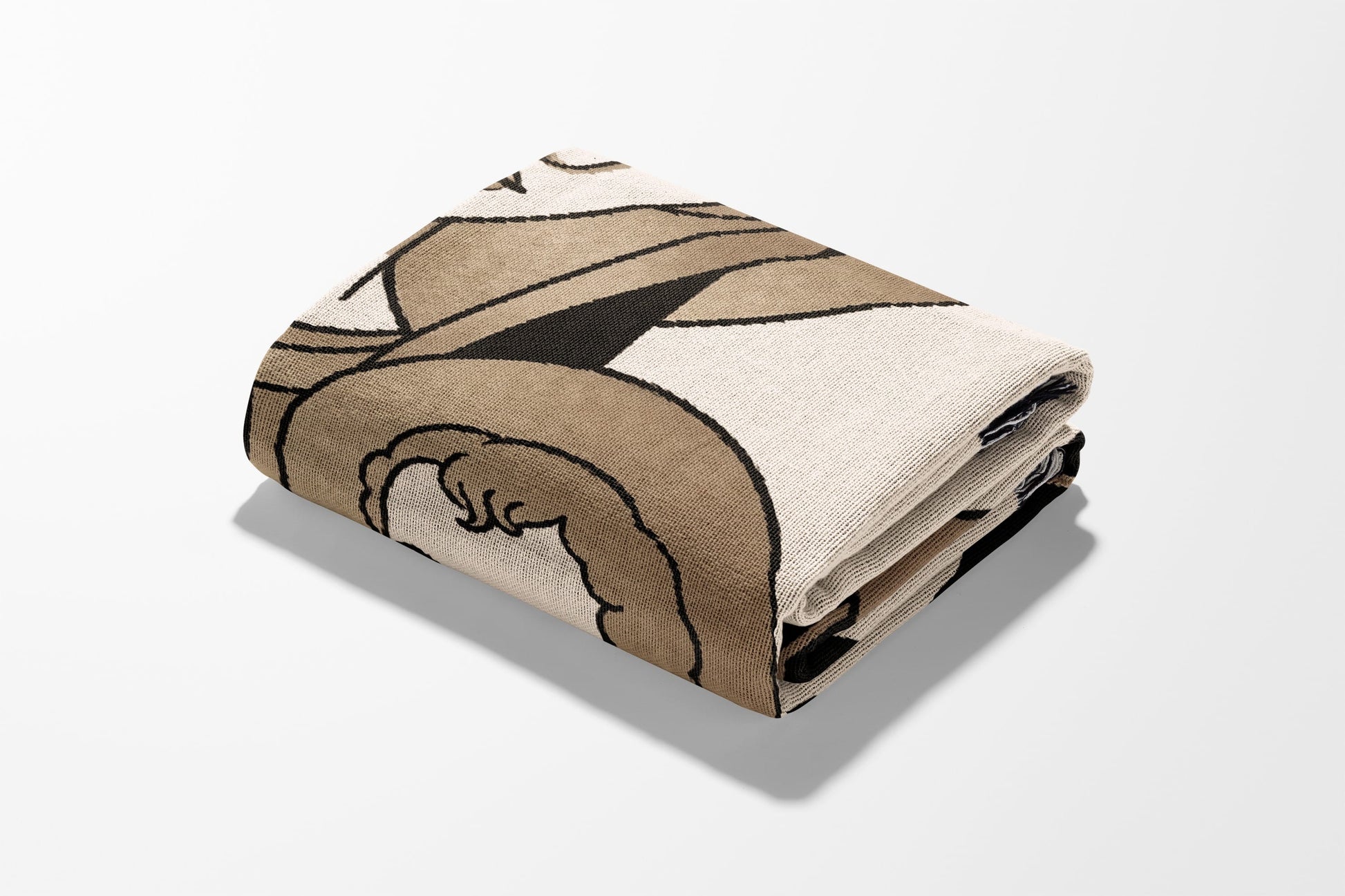 Folded blanket with abstract brown and beige design on white background.