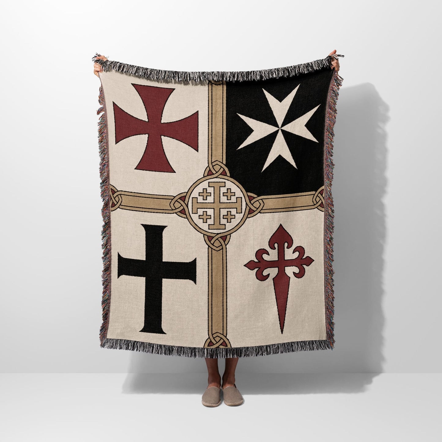 Woven blanket with four heraldic crosses and decorative border.