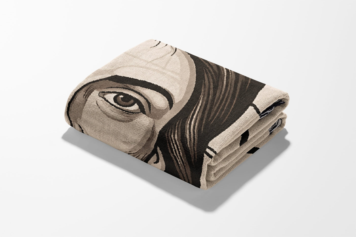 Folded blanket featuring a close-up of a person's eye and part of their face.