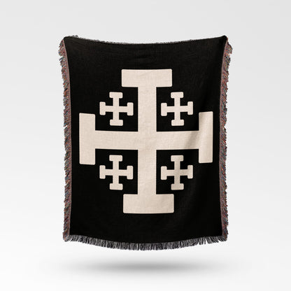 Black throw blanket with a cream Jerusalem cross design.