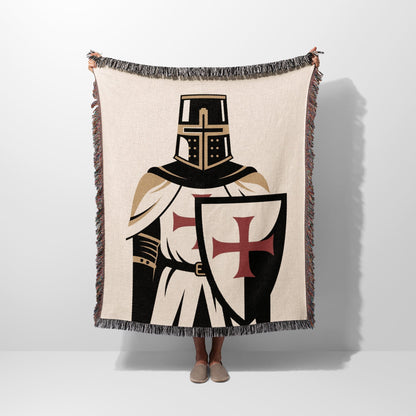 Knight's Templar blanket with cross shield, held up by two hands.