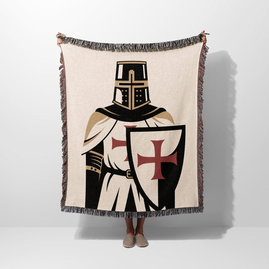 Knight's Templar blanket with cross shield, held up by two hands.