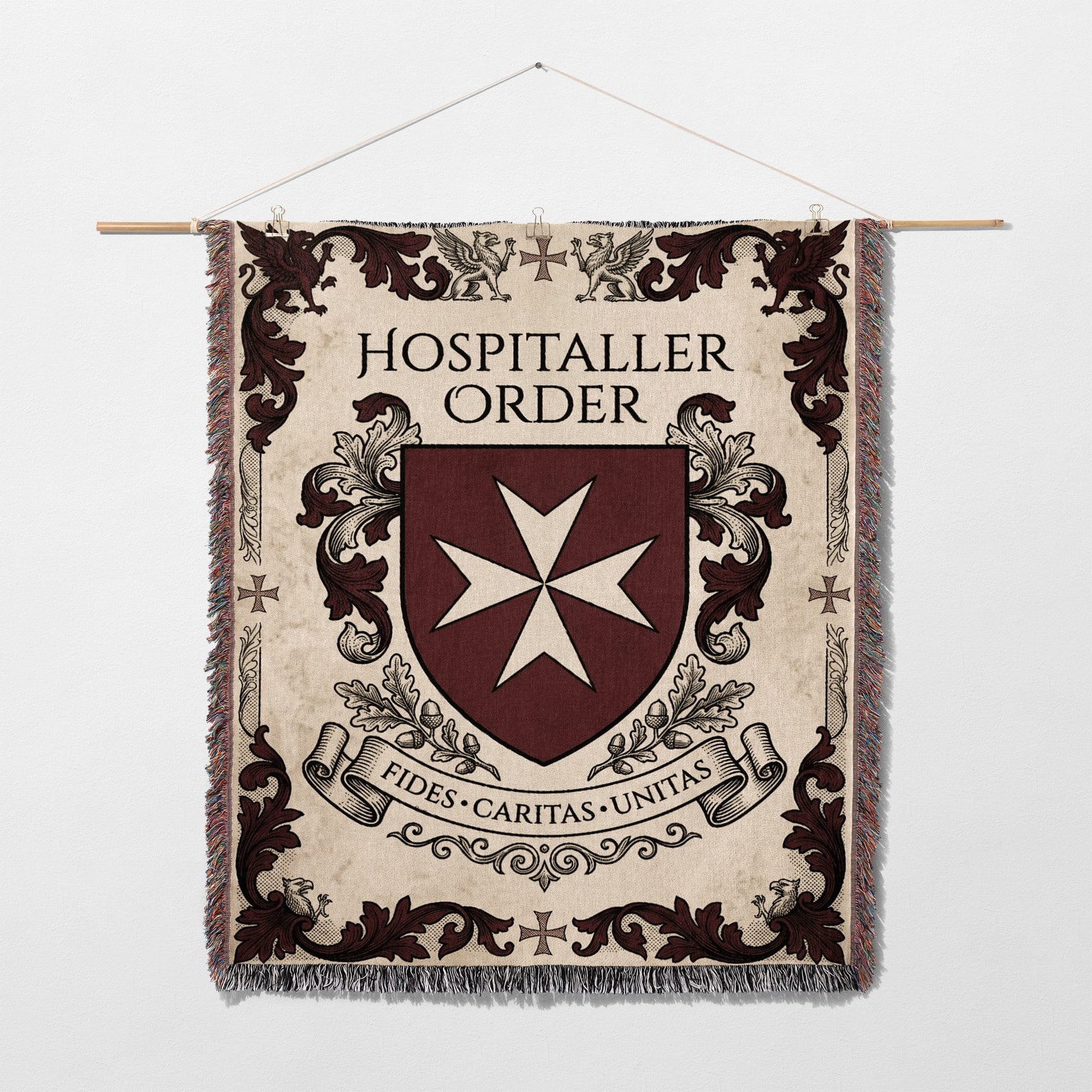 Hospitaller Order crest with Maltese cross and Latin motto on tapestry.