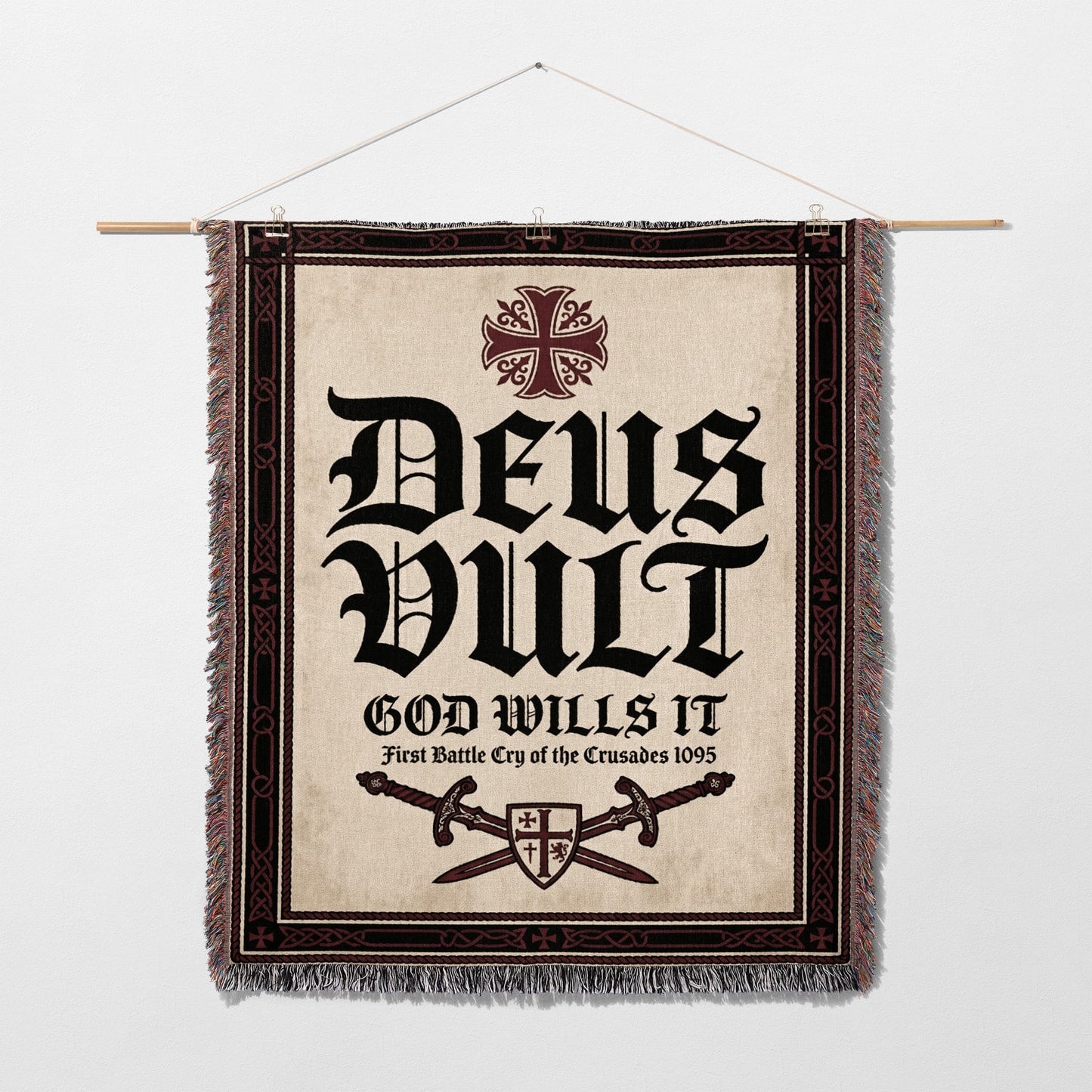 Deus Vult tapestry with crossed swords and crosses, hanging on a wall.