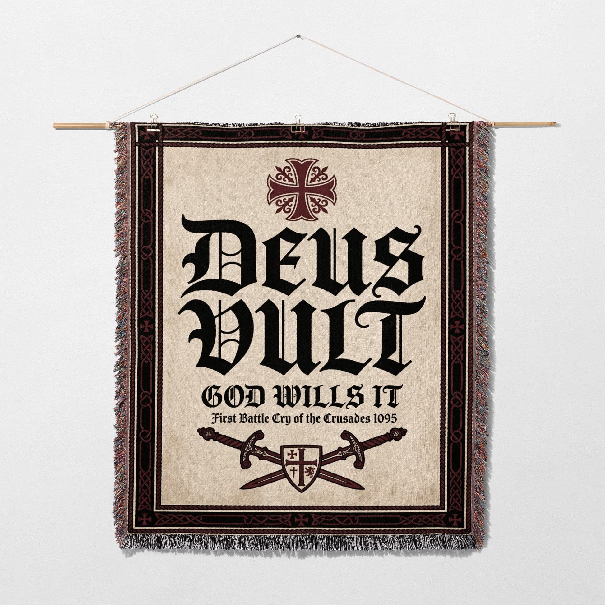 Deus Vult tapestry with crossed swords and crosses, hanging on a wall.