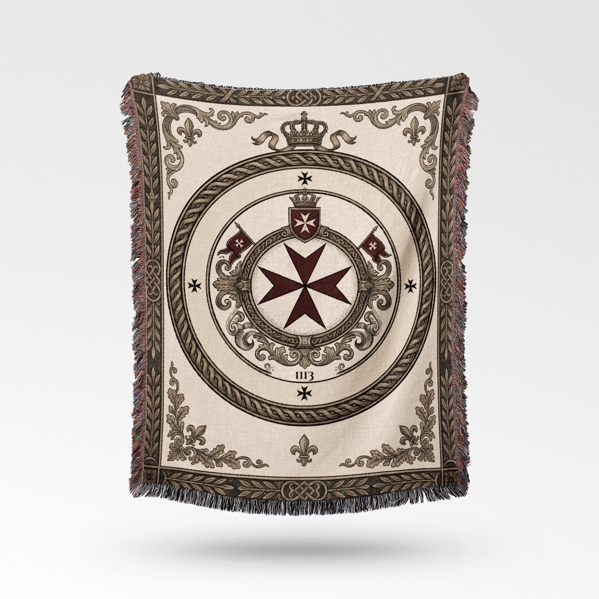 Woven blanket with cream border, crown, and Maltese cross emblem.
