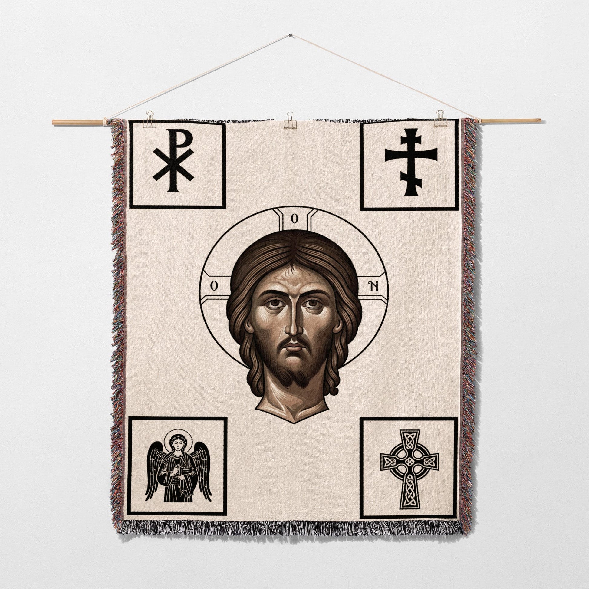 Woven tapestry depicting Jesus Christ's face and religious symbols.