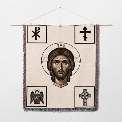 Woven tapestry depicting Jesus Christ's face and religious symbols.