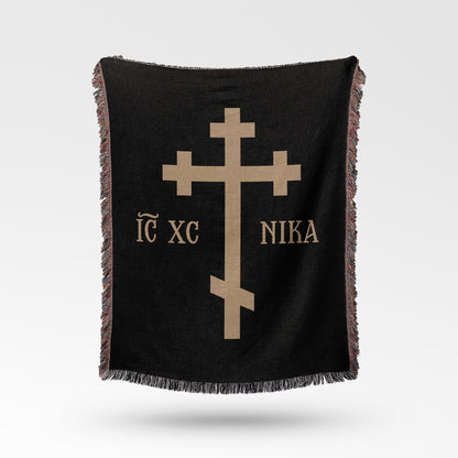 Black throw blanket with gold Greek Orthodox cross and text "IC XC NI KA".
