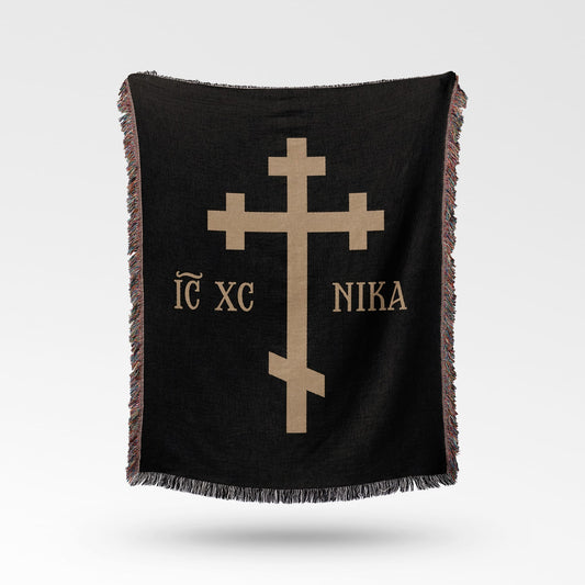 Black throw blanket with gold Greek Orthodox cross and text "IC XC NI KA".