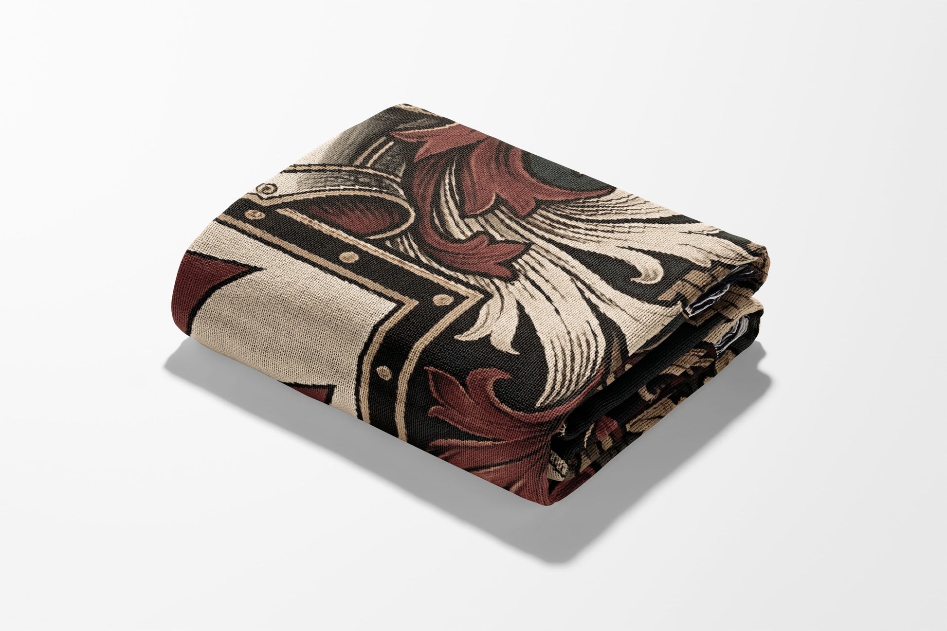 Rolled blanket with ornate beige, brown, and black damask pattern.