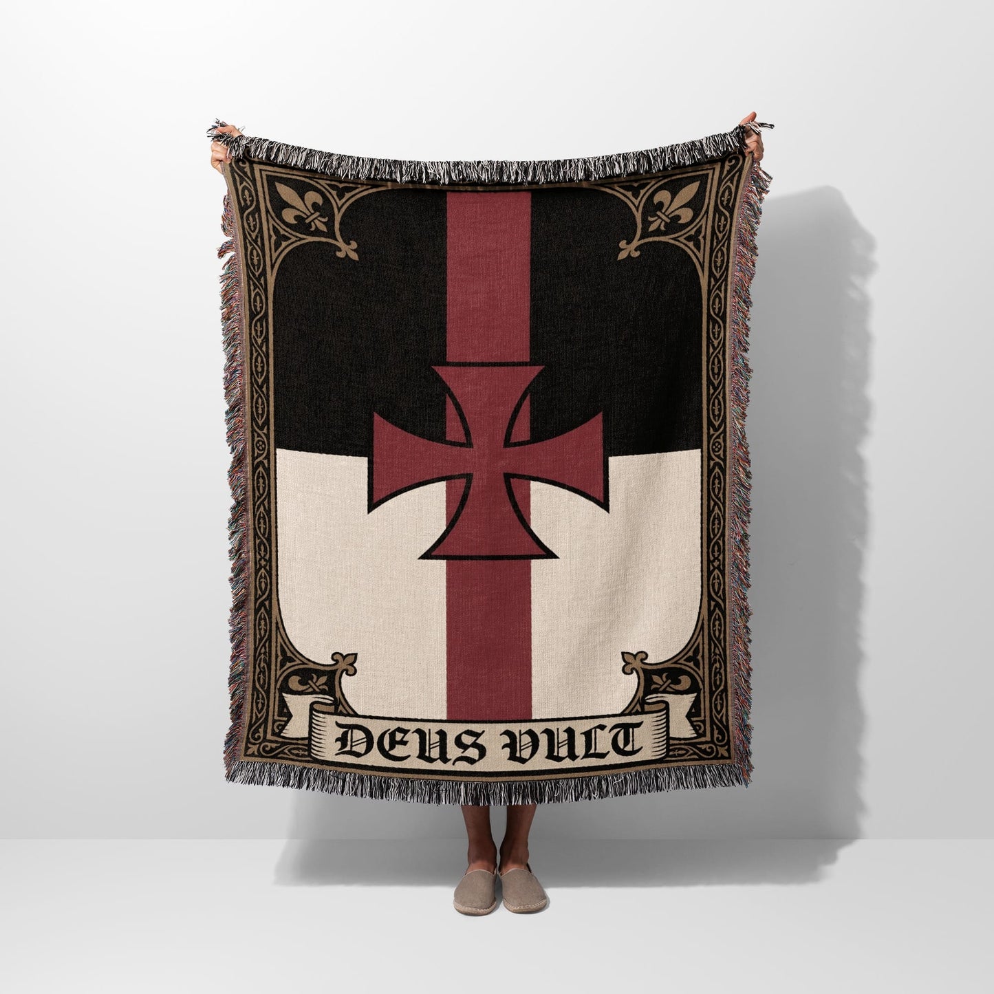 Templar cross blanket with "Deus Vult" text held by two people.
