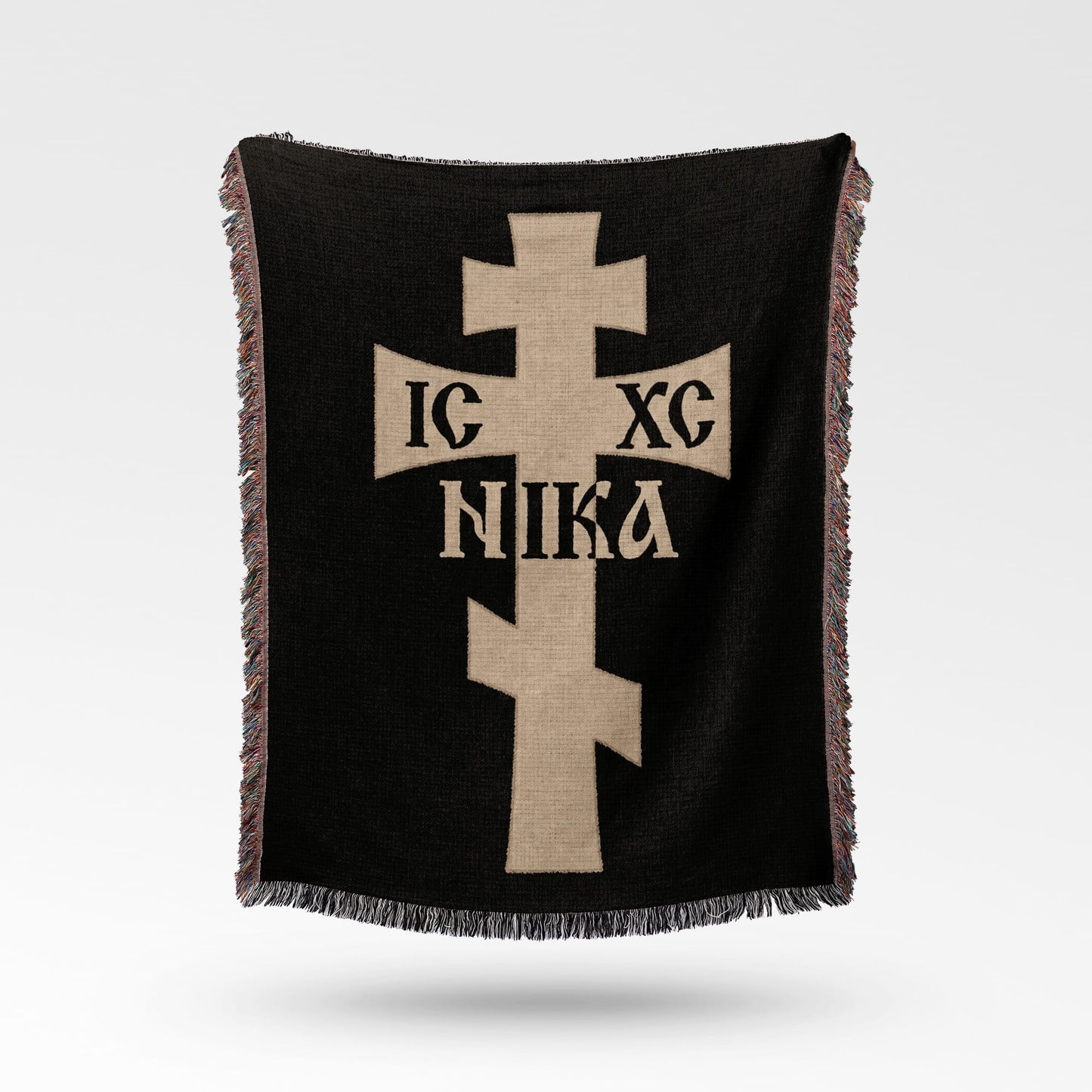 Black woven blanket with a beige cross featuring Greek text "IC XC NIKA".