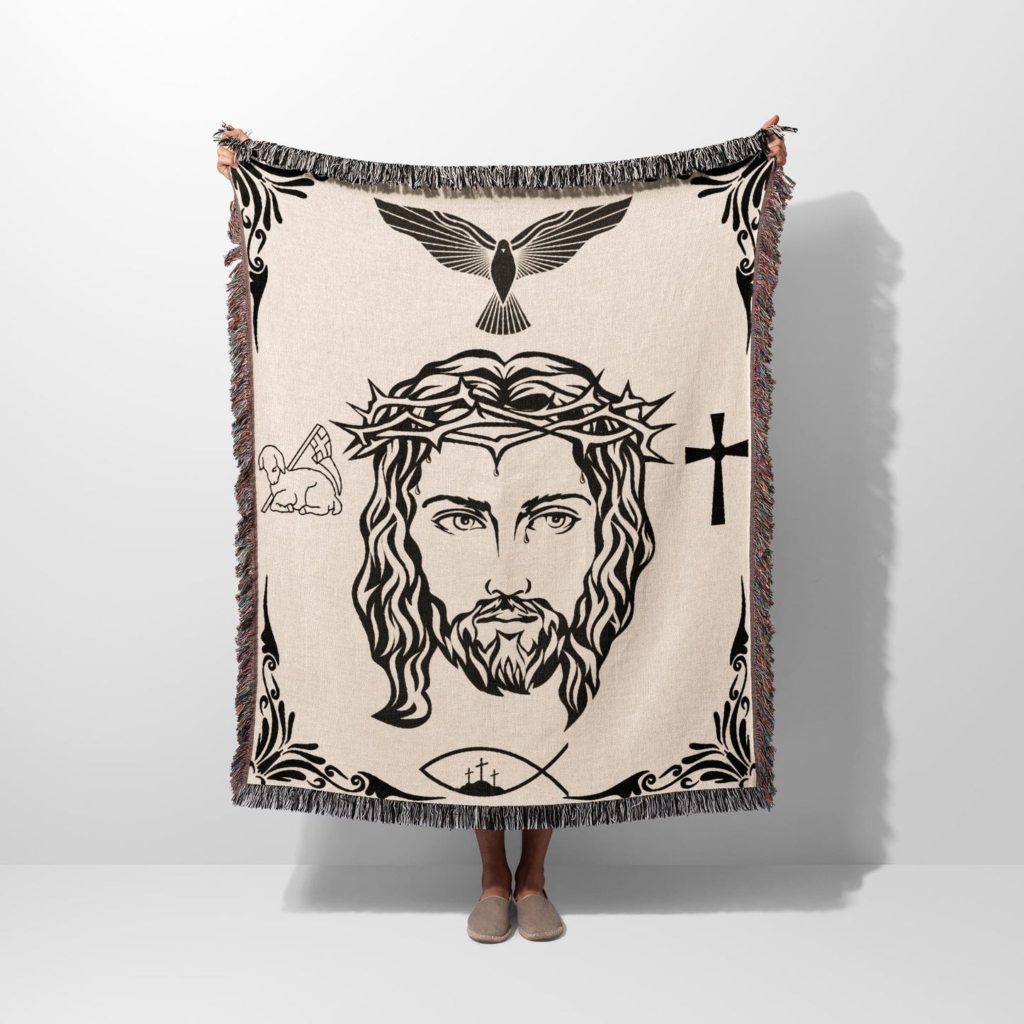Jesus Christ's face with crown of thorns, cross, dove, lamb, and fish.