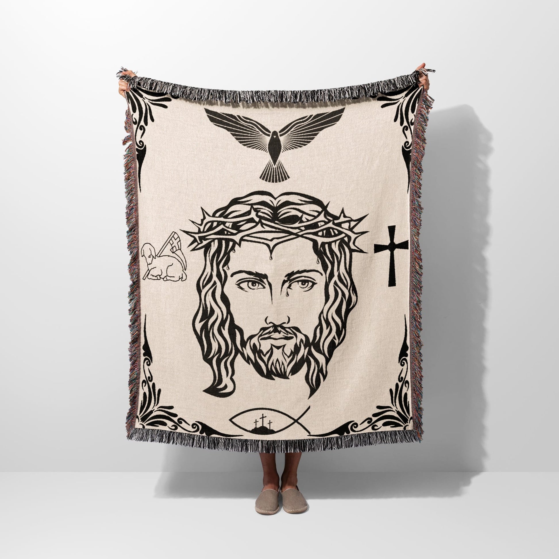 Jesus Christ's face with crown of thorns, cross, dove, lamb, and fish.