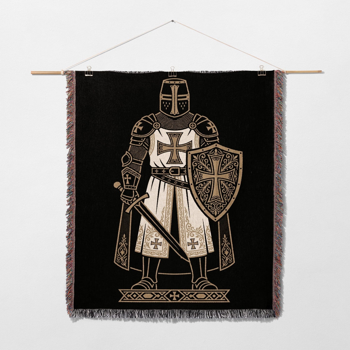Knight in armor with shield and sword on a black tapestry.