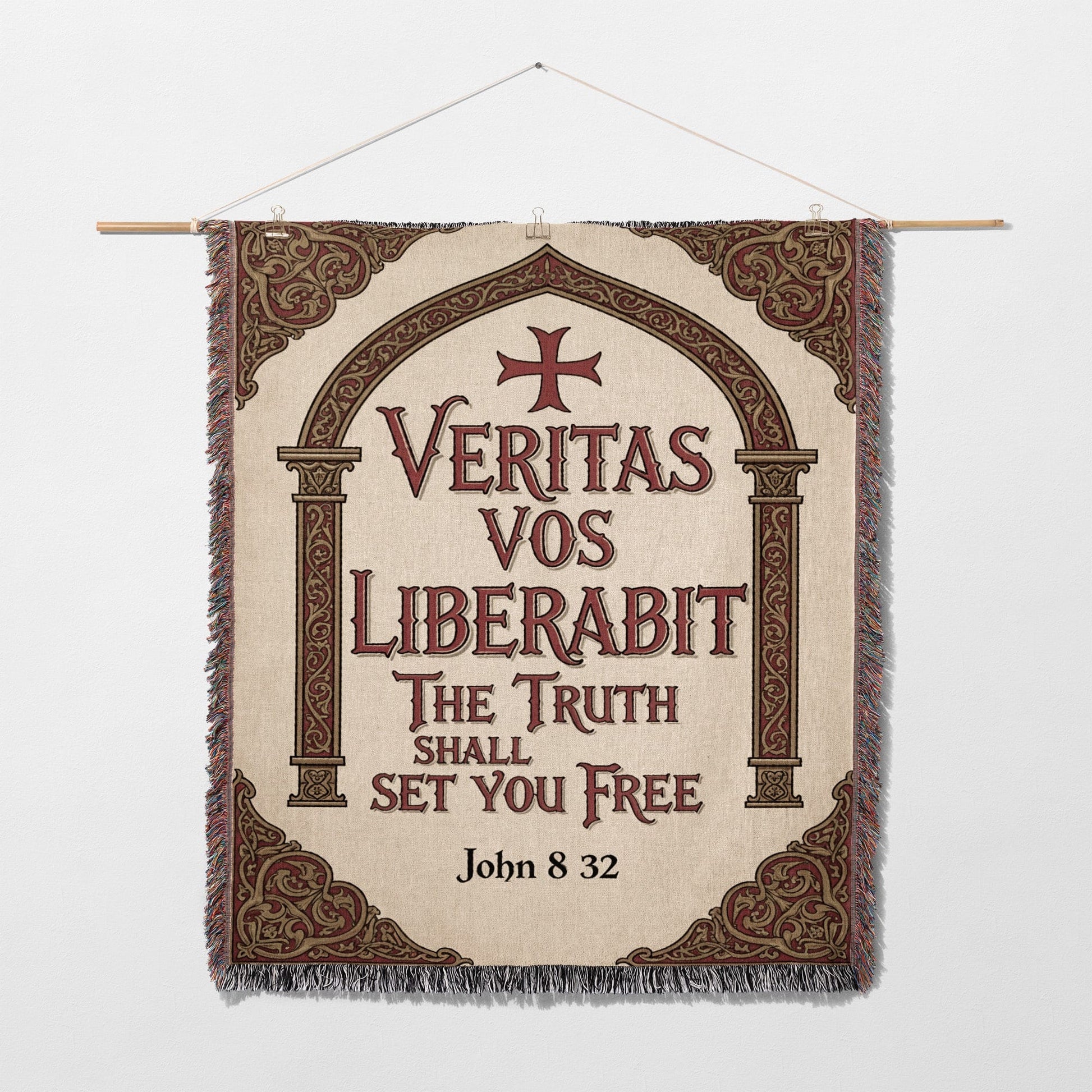 Tapestry with Latin phrase "Veritas vos liberabit" and Bible verse John 8:32.
