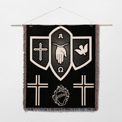 Black tapestry with white religious symbols: hand, dove, crosses, omega, alpha, and heart.