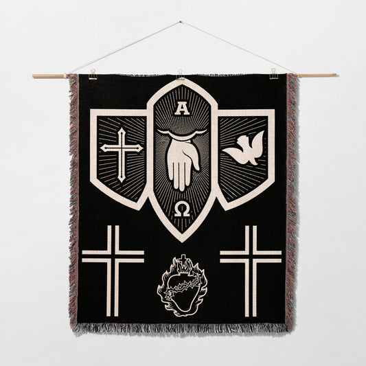 Black tapestry with white religious symbols: hand, dove, crosses, omega, alpha, and heart.