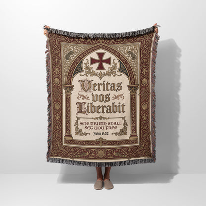 Woven tapestry with ornate cross, Latin text "Veritas vos liberabit", and John 8:32.