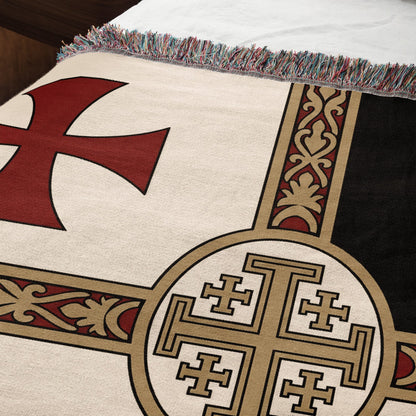 Woven blanket with red Templar cross and Jerusalem cross design.
