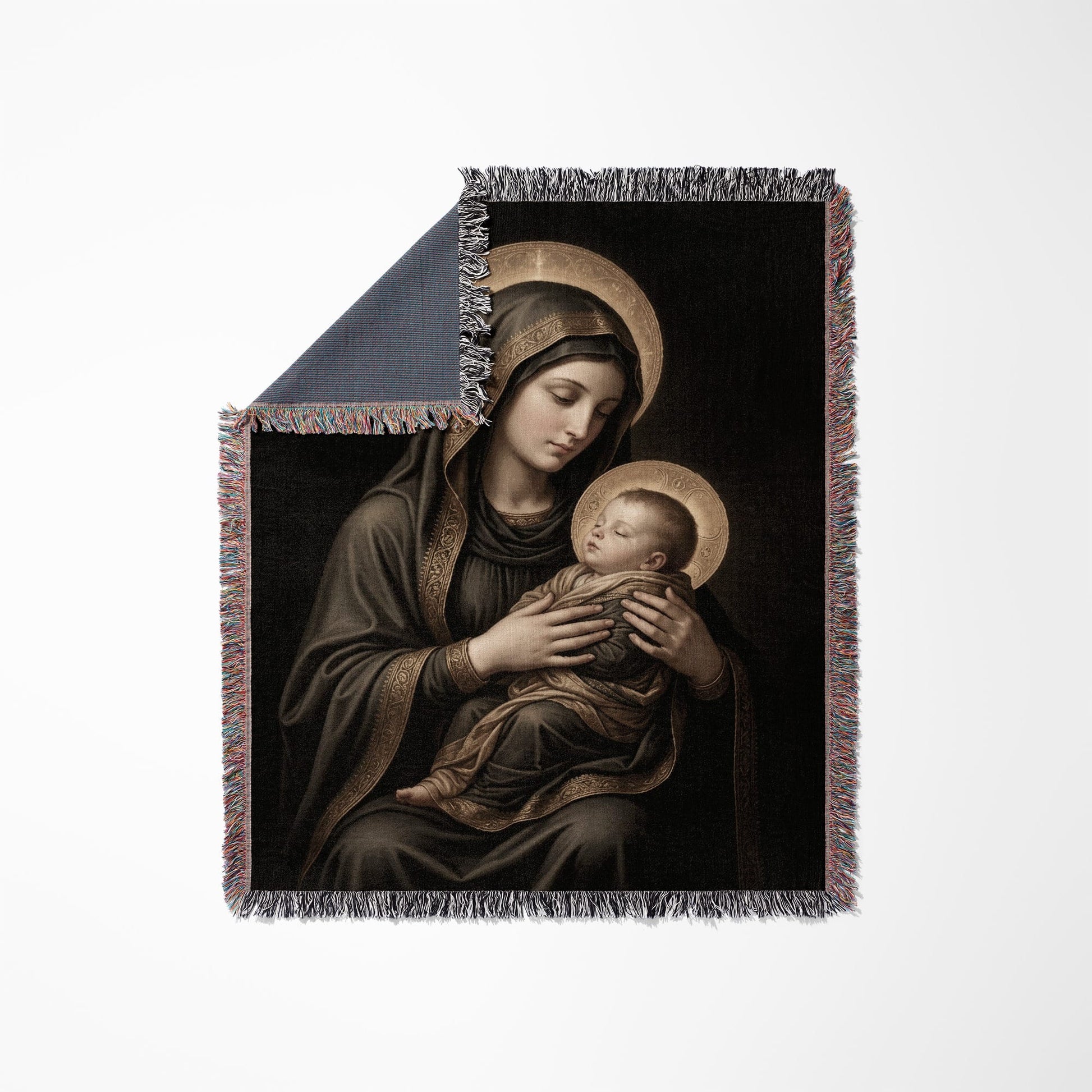Tapestry featuring Madonna and Child artwork with gold halos and decorative fringe.