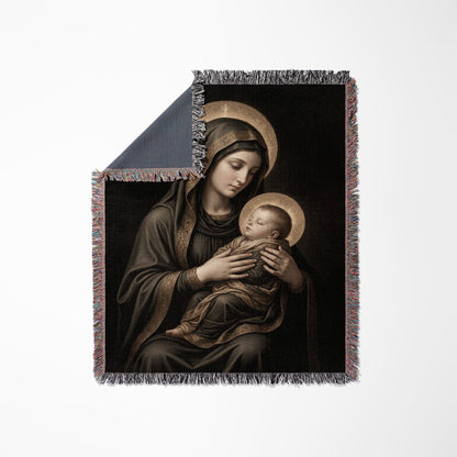 Tapestry featuring Madonna and Child artwork with gold halos and decorative fringe.