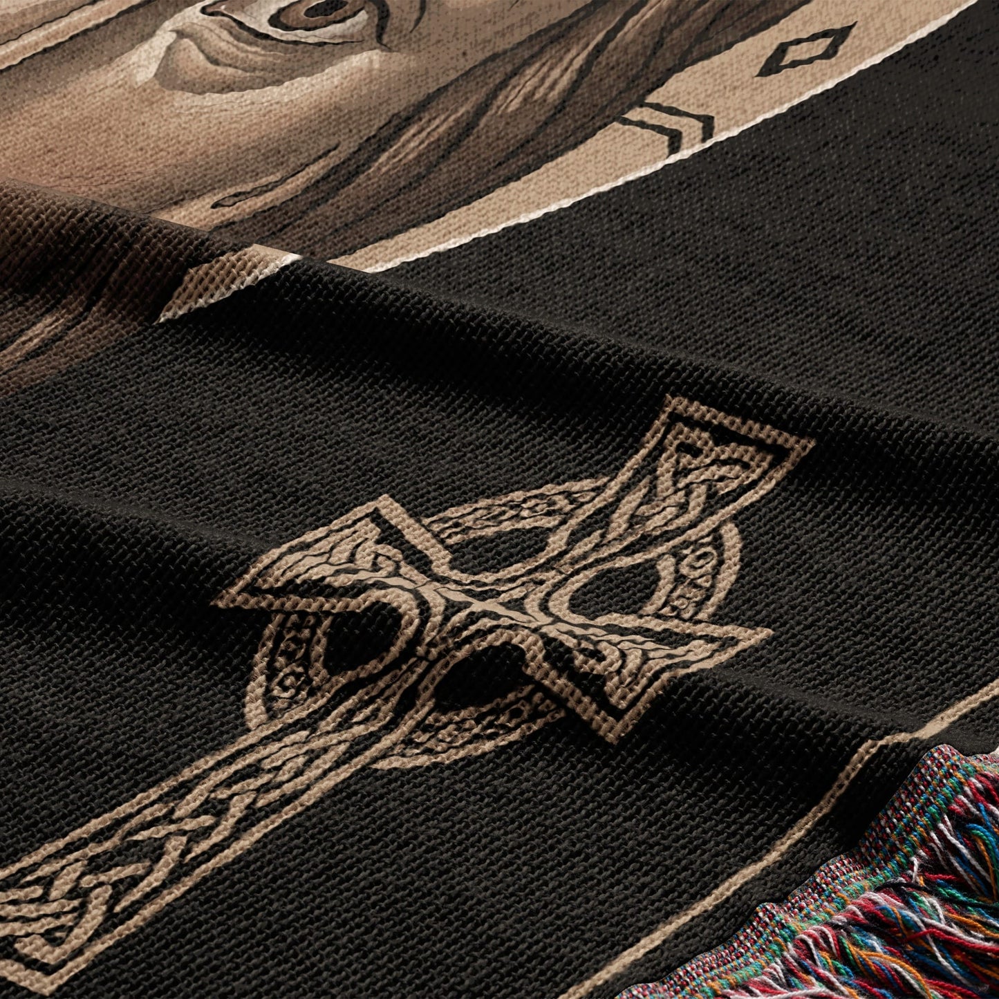 Woven tapestry with Celtic knot and part of a horse's face.