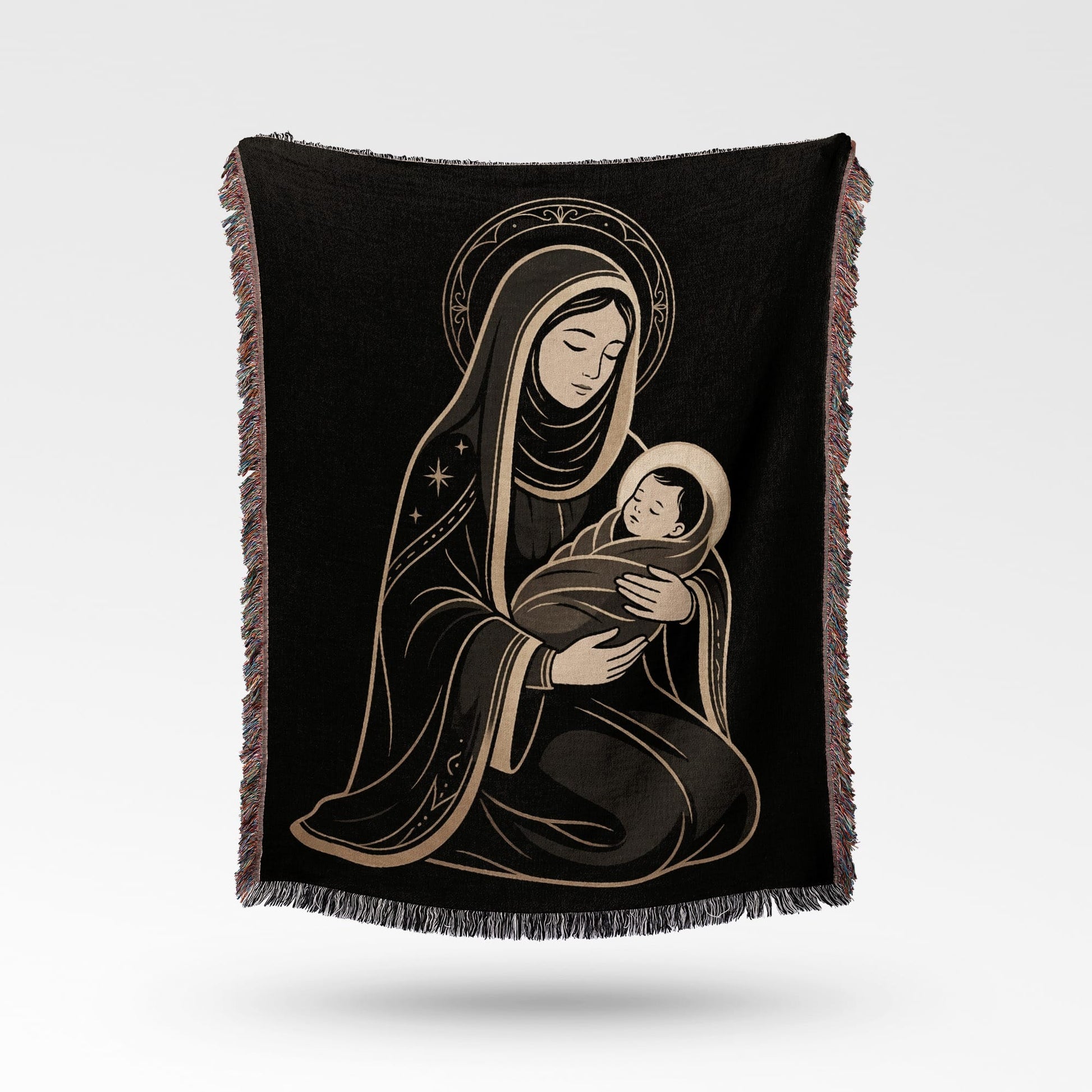 Religious depiction of Madonna and child on a black blanket with fringe.