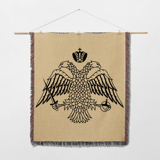 Double-headed eagle crest with crown, sword, and orb on woven tapestry.