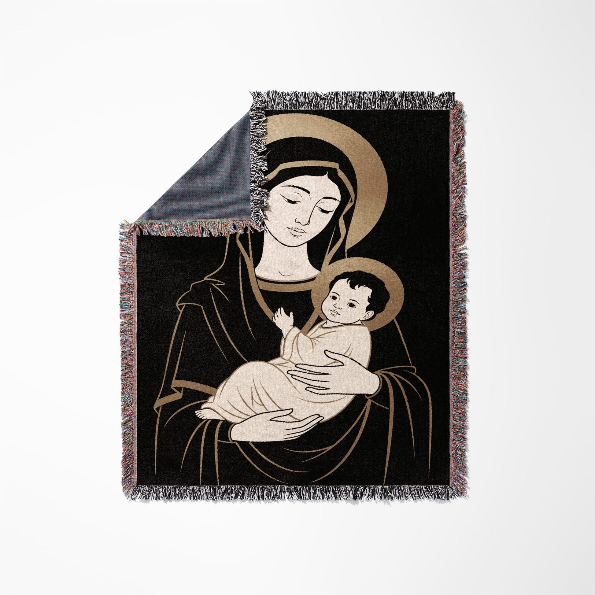 Madonna and Child illustration on a fringed throw blanket.