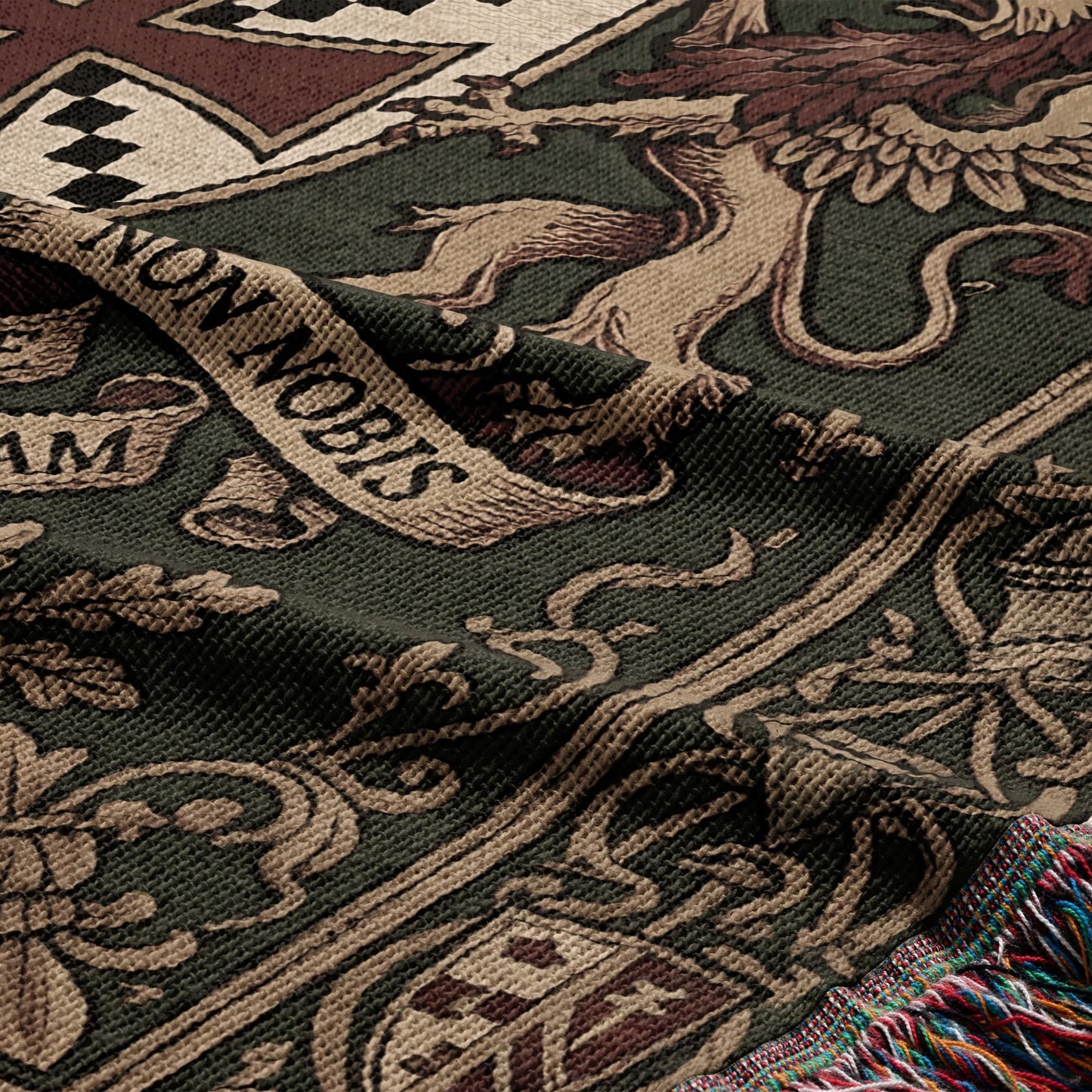 Tapestry throw with griffin, crests, and text "NON NOBIS".