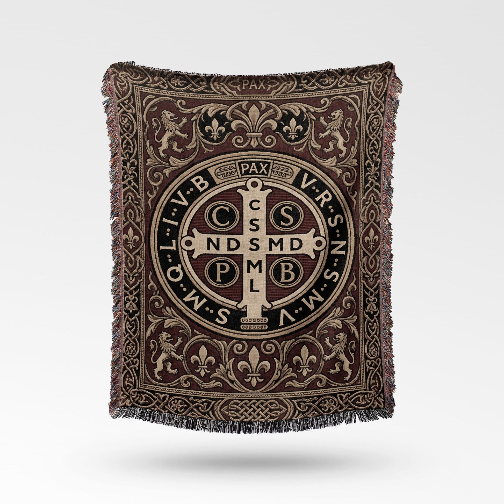 Woven throw blanket with St. Benedict medal, fleur-de-lis, and lion motifs.