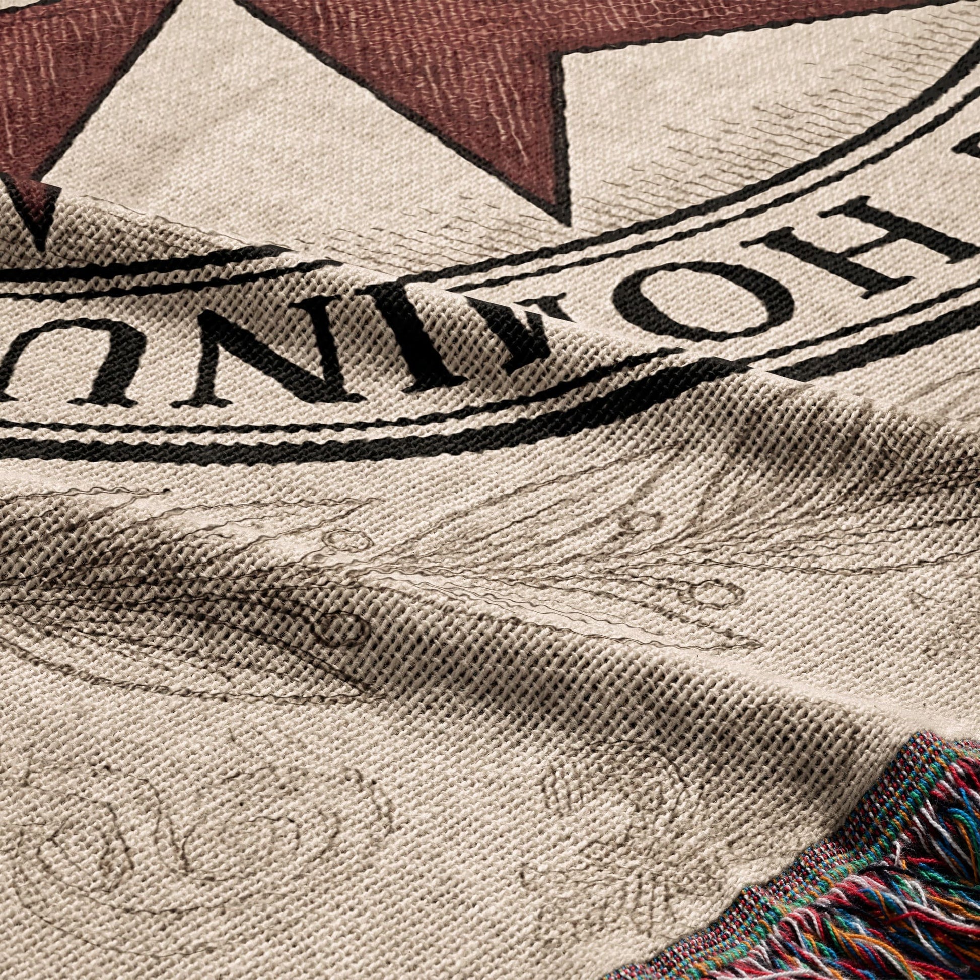 Woven blanket with star and laurel wreath detail, showing "UNION" text.