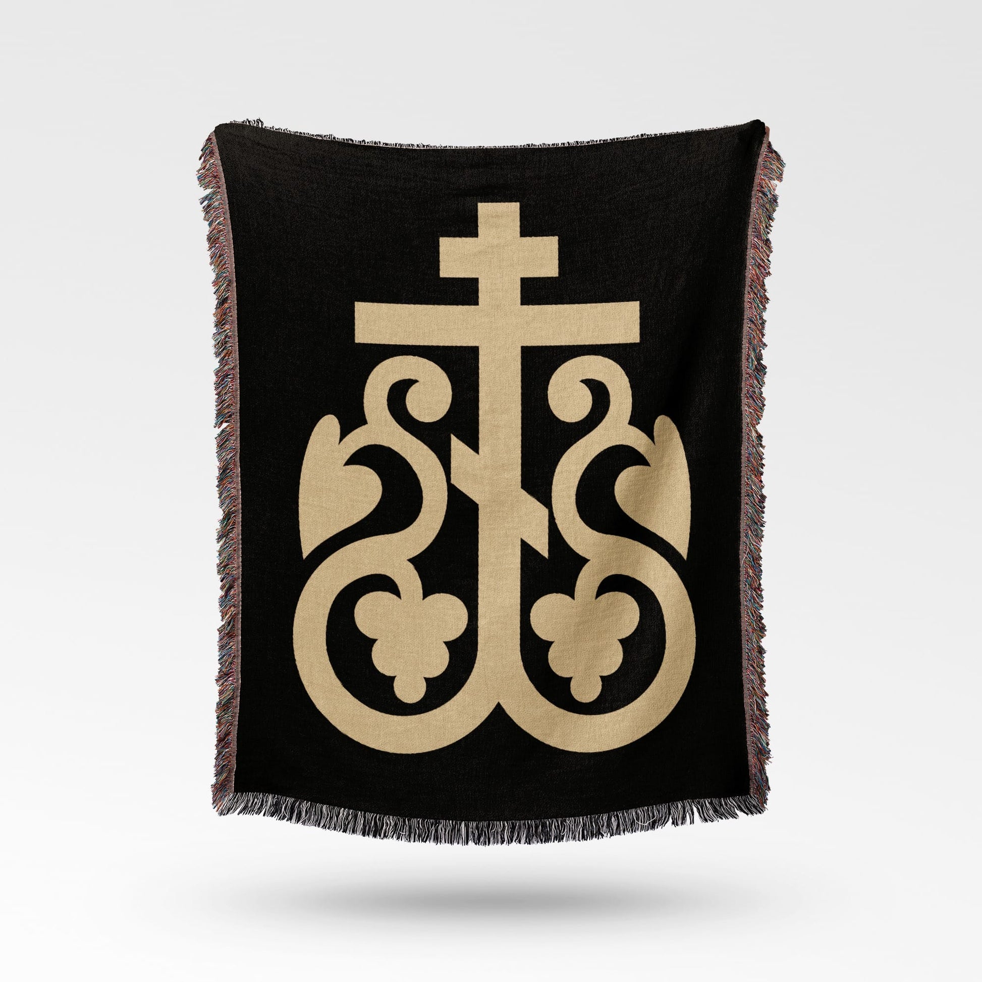 Black blanket with gold Byzantine cross design and fringed edges.