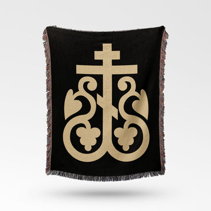 Black blanket with gold Byzantine cross design and fringed edges.