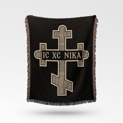 Black woven blanket with Orthodox cross and "IC XC NIKA" inscription.