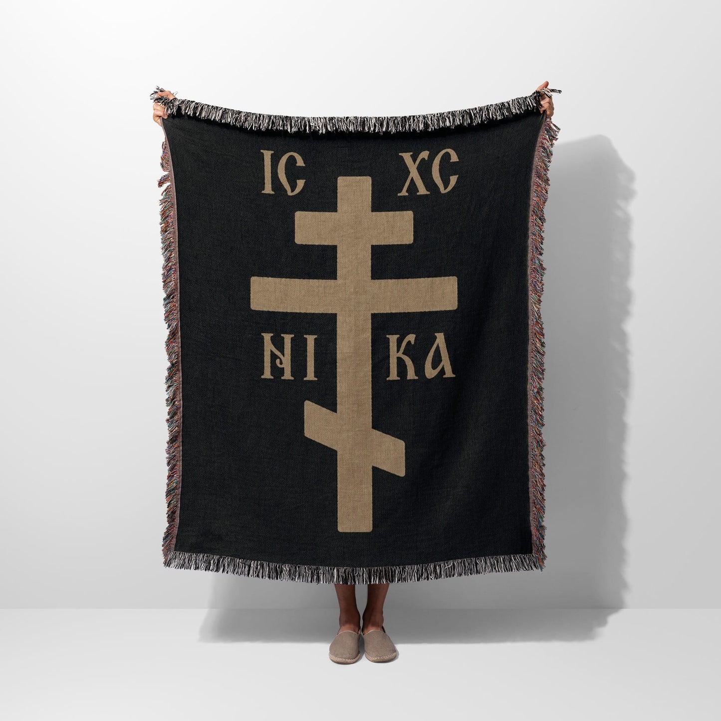 Black throw blanket with gold Eastern Orthodox cross and "NI KA" text.