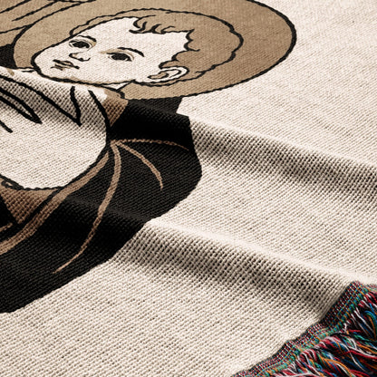 Woven blanket with a close-up of a religious figure's face and halo.