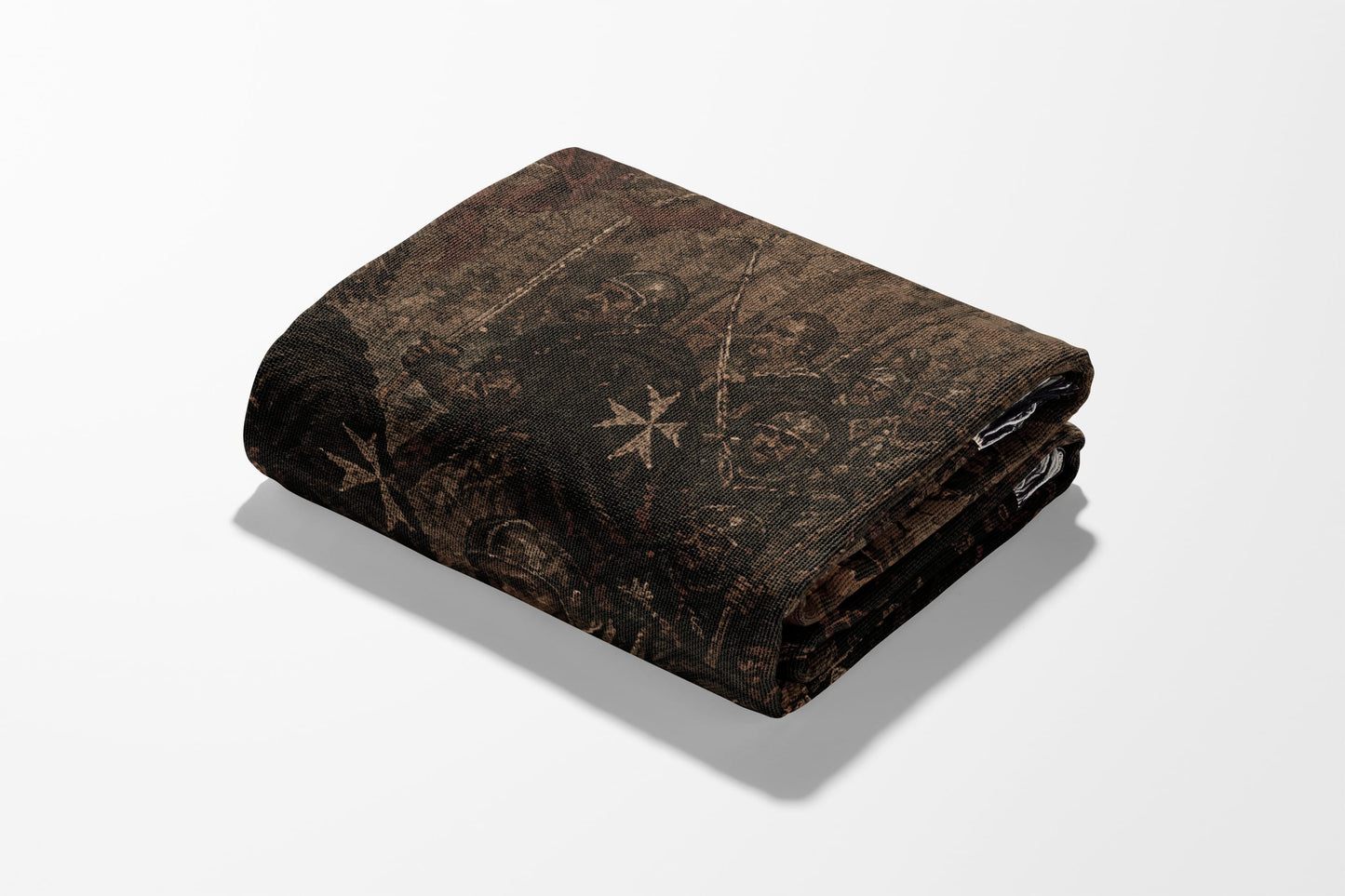 Folded blanket with intricate dark medieval battle scene pattern.